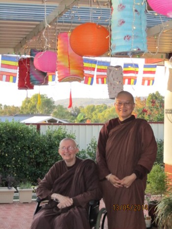 Ayya Vayama Bhikkhuni and Ayya Seri Bhikkhuni with the beautiful Vesak lanterns and lights at on Vesak Day, 12th of May 2014, at Patacara Bhikkhuni Hermitage. Photo by Ming.