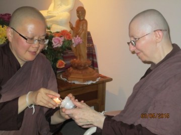 Ayya Vayama Bhikkhuni was lighting the candle to be offered to the Shrine for Vesak Day 3rd of May 2015