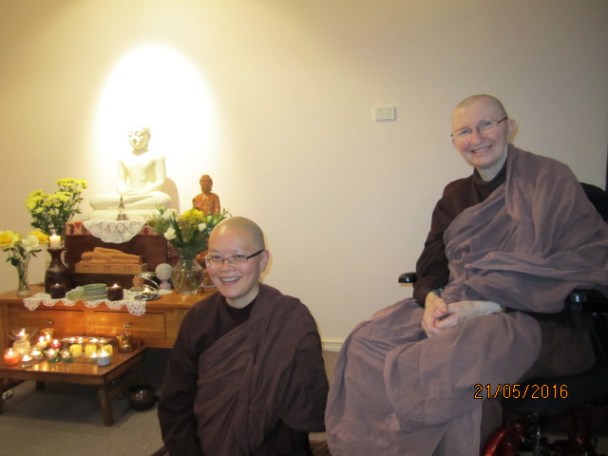 Ayya Vayama Bhikkhuni and Ayya Seri Bhikkhuni with the lights and candles inside the Sala of Patacara Bhikkhuni Hermitage on Vesak Meditation Day 2016. Photo by Ming.