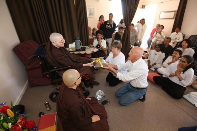 Merry and Trevor Taylor offered the End of Rains Cloth to the Bhikkhunis at Patacata Bhikkhuni hermitage 2016. Photo by Zor